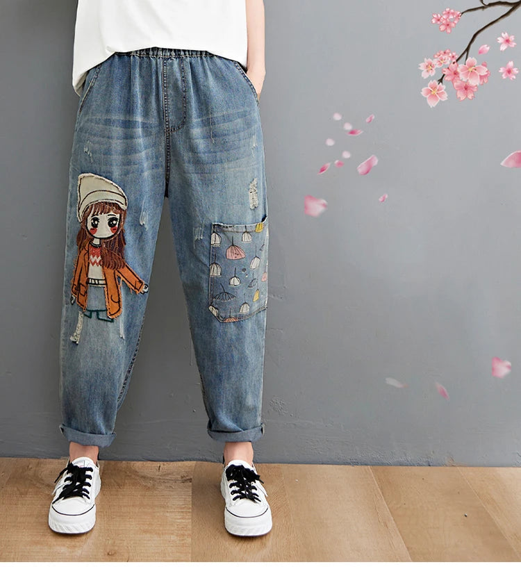Women's Cartoon Embroidery Denim Pants – Casual High-Waist Harem Style with Pockets and Trendy Distressed Details.