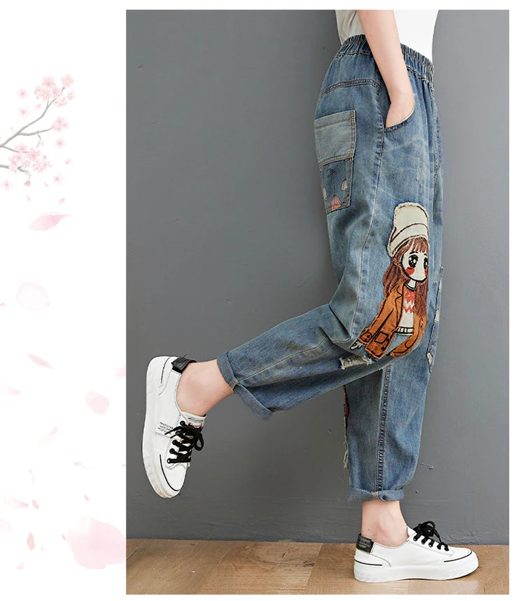 Women's Cartoon Embroidery Denim Pants – Casual High-Waist Harem Style with Pockets and Trendy Distressed Details.