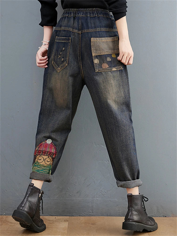 Women's Cartoon Embroidery Denim Pants – Casual High-Waist Harem Style with Pockets and Trendy Distressed Details.